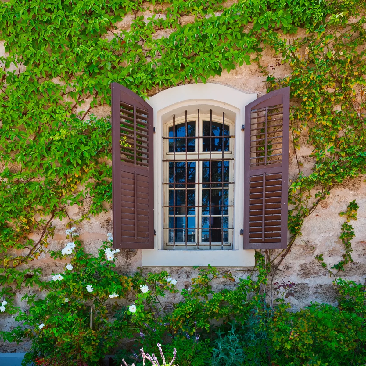 open-window-on-the-facade-of-a-stone-house-decorat-2026-01-09-14-26-40-utc